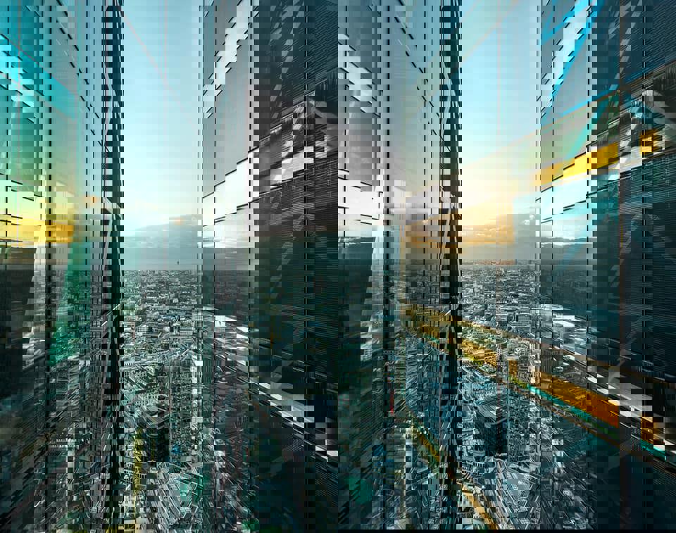 Aerial of city with glass building